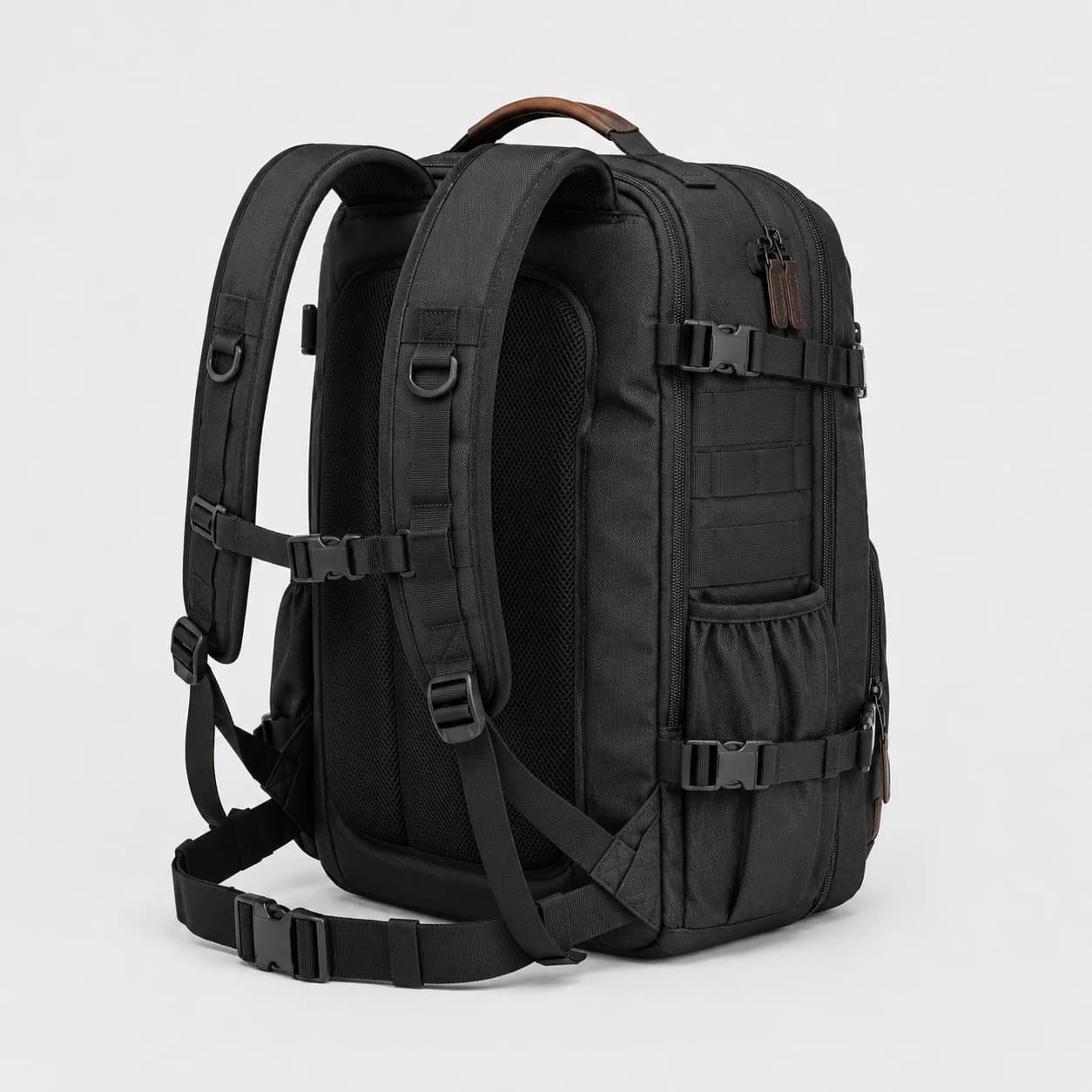 Rear three-quarter view of a black backpack showing padded shoulder straps and mesh back panels