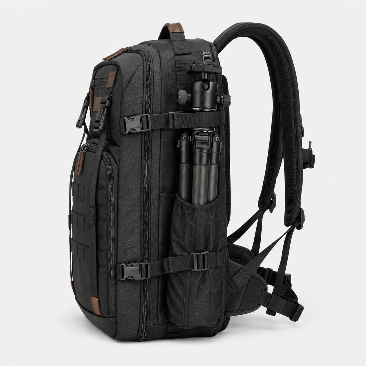 Side view of a black gear backpack with compression straps and a tripod secured in the side holder