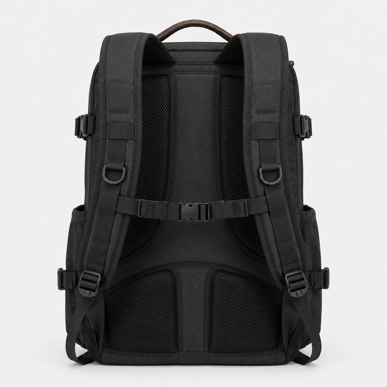 Straight rear view of a black backpack with padded mesh panels, shoulder straps, and a connecting chest strap
