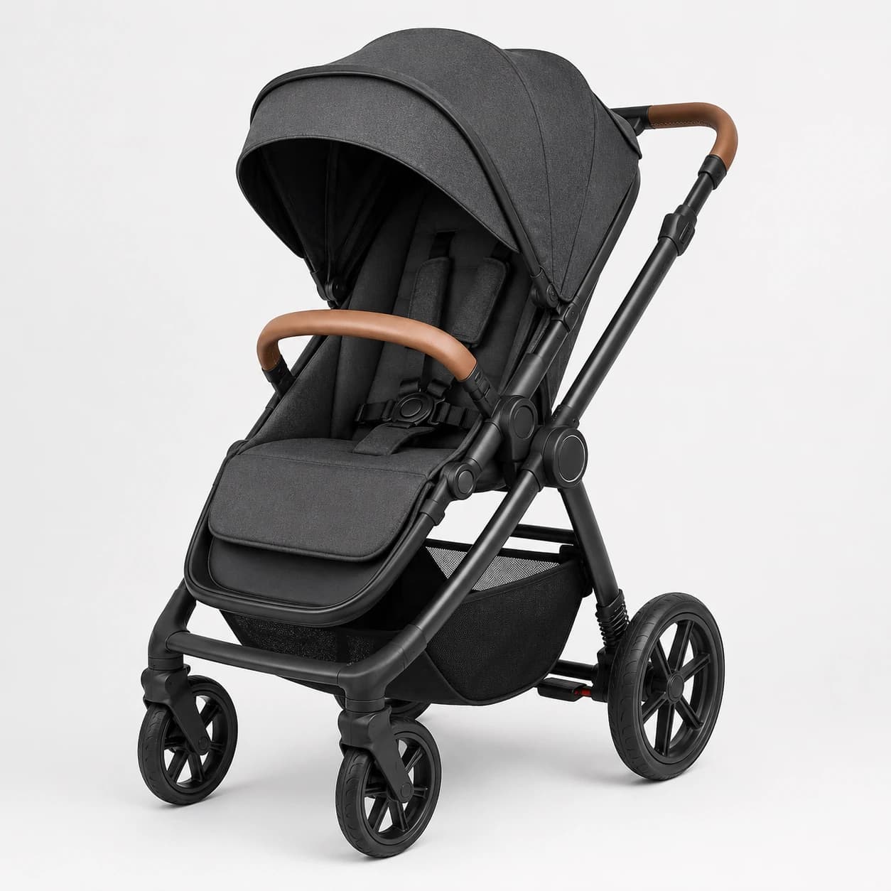 Front three-quarter view of a black baby stroller with a canopy and brown bumper bar